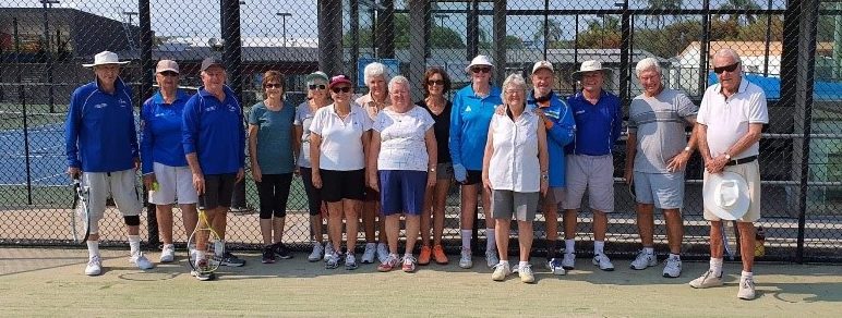 Redcliffe Tennis Centre members grouped together on tennis court for team photo